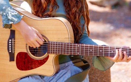 Photo for Nature, camp and closeup of girl with guitar for entertainment, talent or music in woods or forest. Playing, musician and child with acoustic string instrument outdoor in park on weekend trip - Royalty Free Image