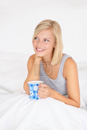 Photo for Morning, tea and woman thinking in bed and relax in home planning ideas for future. Girl, drink and smile with coffee in bedroom remember a dream on holiday or vacation with peace in apartment. - Royalty Free Image