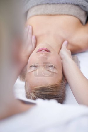 Photo for Young woman, relax and massage in spa for health, wellness and peace with hands for shoulder pain. Person, comfort or release of muscle tension by masseuse, body treatment or detox in resort for zen. - Royalty Free Image