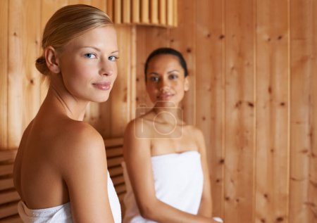 Photo for Sauna, portrait and women relax in spa for beauty, healthy detox of sweat for skincare wellness. Luxury, treatment and friends sitting together in steam room for facial, anti aging or benefits. - Royalty Free Image