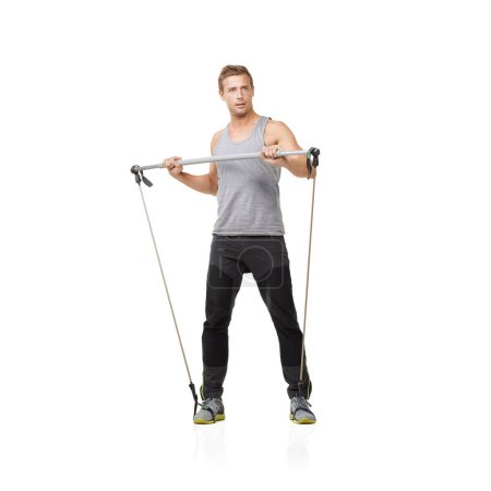 Photo for Gym, fitness and resistance band with a strong man in studio isolated on a white background for health. Idea, exercise or performance and a young athlete training with equipment for wellness. - Royalty Free Image