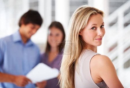 Photo for Happy business woman, office and smile in portrait, confidence and pride for career in company. Female person, face and collaboration with colleagues in blurred background, teamwork and support. - Royalty Free Image