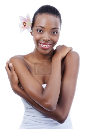 Photo for Black woman, portrait and flower for natural beauty, wellness and dermatology with nature on white background. Orchid, eco friendly cosmetics and body care with skin and clean skincare in studio. - Royalty Free Image