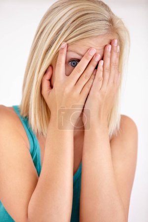 Photo for Fear, portrait and woman with hands on face, scared and confused with trauma in horror studio. Panic, scary danger and shocked embarrassed girl with stress, anxiety and terror on white background - Royalty Free Image