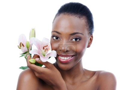 Photo for Black woman, flower and portrait with natural beauty, dermatology and skincare for glow and wellness on white background. Nature, skin and sustainable cosmetics, face with shine and orchid in studio. - Royalty Free Image