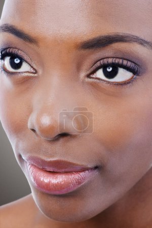 Photo for Makeup, beauty and face of black woman on gray background for wellness, cosmetics and skincare. Dermatology, salon aesthetic and closeup of person with eyeshadow, lipstick and glamour in studio. - Royalty Free Image