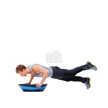 Photo for Man, workout and push ups with ball for fitness, exercise or training on a white studio background. Active male person lifting body challenge for strength, muscle or strong arms on mockup space. - Royalty Free Image