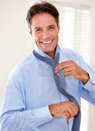 Photo for Portrait, tie and happy businessman dressing in home, job or entrepreneur preparation in the morning. Face, professional and getting ready for working, person tying necktie and consultant in house. - Royalty Free Image