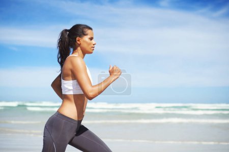 Photo for Fitness, Indian or woman on beach running for exercise, training or outdoor workout at sea. Sports person, runner or healthy athlete in nature for cardio endurance, wellness or challenge on sand. - Royalty Free Image