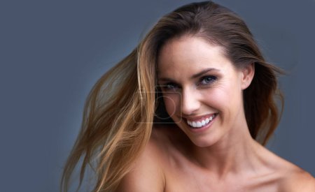 Photo for Hair, portrait or happy woman in studio with cosmetic, shampoo or beauty results on grey background. Haircare, face or lady model with growth, shine or texture satisfaction or clean scalp confidence. - Royalty Free Image