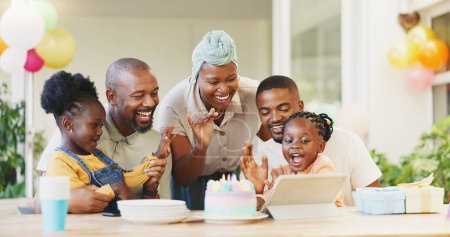 Photo for Black family, birthday cake and candles for children to celebrate with parents at a table. African woman, men and happy kids at home for a party, quality time and bonding or fun with love and care. - Royalty Free Image