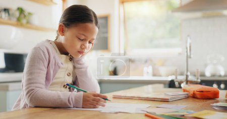 Photo for Tired, yawn and child with homework in kitchen, bored and doing project for education. Fatigue, morning or young girl with adhd yawning while drawing, learning writing or school knowledge in a house. - Royalty Free Image