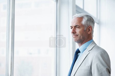 Photo for Mature, man and thinking of business at window, planning for future and idea for office. Professional, mindset and businessman remember a dream for company and consider decision, choice or solution. - Royalty Free Image