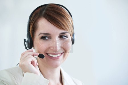 Photo for Woman, callcenter and phone call with headset and mic, CRM or contact us with smile for communication. Telecom, customer service or telemarketing with agent for tech support or help desk at office. - Royalty Free Image
