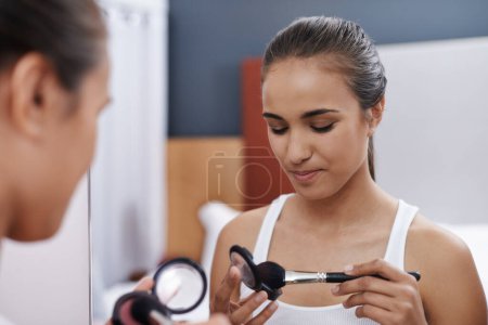 Photo for Woman, makeup and mirror for date, cosmetic or interview for fashion artist. Female, blush and eyeshadow for beauty, self care and foundation in bedroom to prepare for graduation and after party. - Royalty Free Image