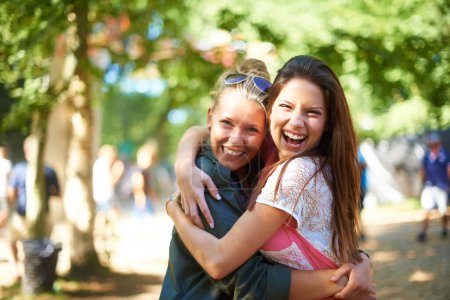 Photo for Portrait, girls or happy friends hug at music festival outdoor, event or bonding at concert. Face, embrace or women together at party for celebration, carnival or smile of people having fun in nature. - Royalty Free Image