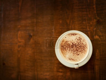 Photo for Top view wooden table, coffee cup or mock up restaurant, cafe or retail diner for beverage service, wellness drinks or espresso. Fresh caffeine aroma, warm latte and desk with morning hot chocolate. - Royalty Free Image