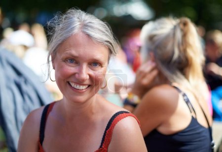 Photo for Portrait, smile and mature woman at music festival outdoor, event or social gathering. Face, happy and senior person at party, carnival or concert with positive expression for celebration in Denmark. - Royalty Free Image