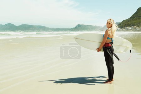 Photo for Portrait, smile and woman with surfboard at beach on space for sports, travel or hobby in summer. Fitness, surfing and vacation with happy young person on tropical coast for holiday or island getaway. - Royalty Free Image