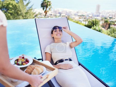 Photo for Hotel, pool and woman with luxury breakfast for business trip, smile and relax with rooftop service. Travel, hospitality and happy businesswoman on lounge chair for brunch, sunshine and villa holiday. - Royalty Free Image