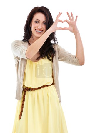Photo for Woman, portrait and heart hands for thank you in studio, kindness and peace emoji or symbol. Happy female person, support icon and smiling on white background, romance emoticon and gratitude for care. - Royalty Free Image