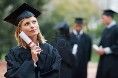 Photo for Graduation, certificate and thinking with student woman outdoor on campus for university or college event. Future, planning and vision with young graduate at school for education or scholarship. - Royalty Free Image