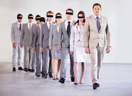 Business people, blindfold and leader for team confidence, united and lost in workplace. Management, employees and collaboration in uncertainty, control strategy and support in direction or workforce.