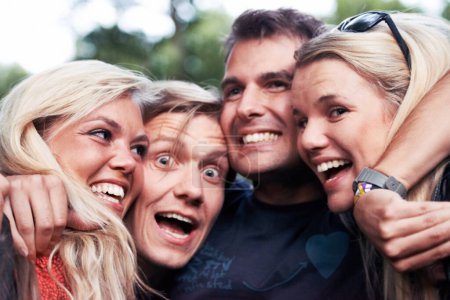 Photo for Face, smile and hug with excited friends closeup outdoor in nature together for travel, festival or adventure. Party, energy or wow with man and woman group laughing in forest or woods in summer. - Royalty Free Image