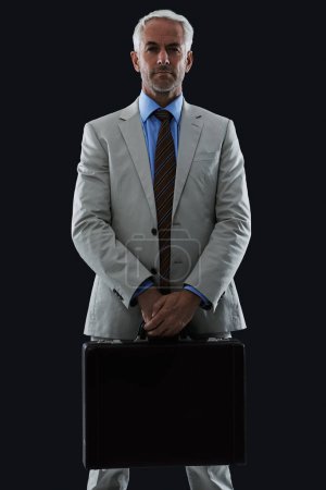 Photo for Senior, businessman and portrait or briefcase in studio with confidence and pride for corporate career or job. Mature, entrepreneur and ceo with face, thoughtful and contemplating on black background. - Royalty Free Image