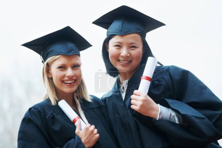 Photo for Portrait, smile and graduation with student friends outdoor at overcast campus for certificate celebration. Face, education and success with college women at university for ceremony of tradition. - Royalty Free Image