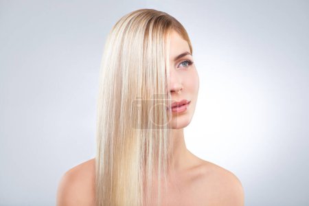 Photo for Straight hair, beauty and blonde woman in makeup, care or thinking isolated on a white studio background. Face, hairstyle and serious model in cosmetics, hairdresser and salon treatment for keratin. - Royalty Free Image