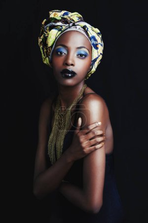 Photo for Black woman, beauty and portrait with fashion, skincare and makeup in studio. Cosmetics, trendy and afro style with African female person from Kenya with traditional hair wrap with black background. - Royalty Free Image