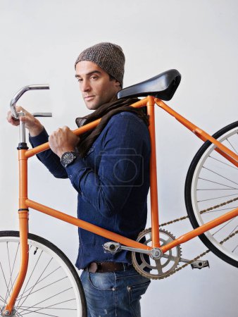 Photo for Man, studio and bicycle for sustainability, exercise and transportation on white background. Hipster cyclist, carbon neutral and eco friendly travel for environmental commute or fitness and trip. - Royalty Free Image