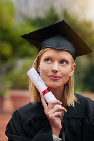 Photo for Graduation, certificate and future with student woman outdoor on campus for university or college event. Thinking, planning and vision with young graduate at school for education or scholarship. - Royalty Free Image