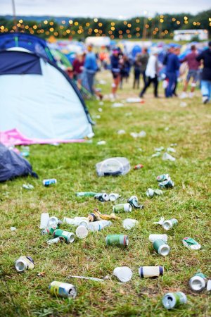 Photo for Field, festival and litter with drinks, beer and beverage product for drinking a can in party. Concert outdoor pollution or alcohol on ground, grass or floor by trash or garbage with dirt or mess. - Royalty Free Image