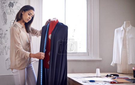 Photo for Fashion, fitting and tailor measure on mannequin for sewing in workshop with creative project. Seamstress, measuring tape and work with textile fabric for garment in boutique with material on dummy. - Royalty Free Image