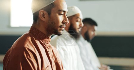 Photo for Islamic, praying and men in a Mosque for spiritual religion together as a group to worship Allah in Ramadan. Muslim, Arabic and holy people with peace or respect for gratitude, trust and hope. - Royalty Free Image