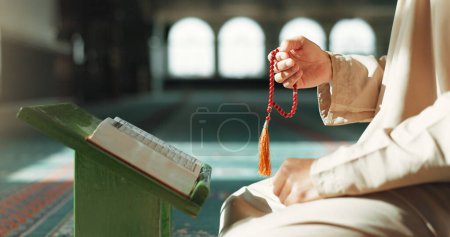 Photo for Islam, prayer beads and man in mosque with Quran, mindfulness and gratitude in faith. Worship, religion and Muslim scholar in holy temple for praise with book, spiritual teaching and peace meditation. - Royalty Free Image