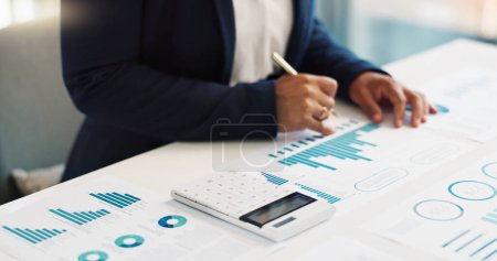 Photo for Business hands, calculator and financial data analytics, graphs or charts for revenue, profit or budget report. Accountant or bookkeeping person writing on documents, planning numbers and statistics. - Royalty Free Image