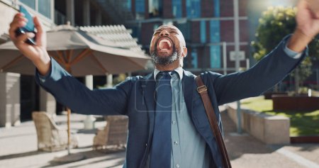 Photo for Business, celebration and senior man with phone in city street for news, success and winner fist victory. Smartphone, app and African male entrepreneur outdoor with competition prize, reward or bonus. - Royalty Free Image