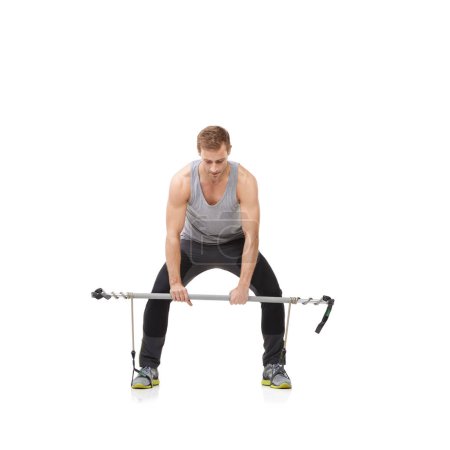 Photo for Exercise, gym and resistance band with a strong man in studio isolated on a white background for health. Fitness, workout or performance and a young athlete training with equipment for wellness. - Royalty Free Image