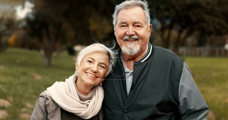 Photo for Face, love and happy with a senior couple outdoor in a park together for a romantic date during retirement. Portrait, smile or care with an elderly man and woman bonding in a garden for romance. - Royalty Free Image