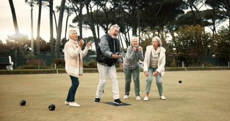 Photo for Senior man, team and bowling on grass with miss, fail or support for fitness, sport or game in retirement. Teamwork, group and elderly women with metal ball, exercise or kindness for training on lawn. - Royalty Free Image