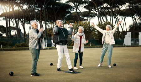 Photo for Bowls, high five and celebration with senior friends outdoor, cheering together during a game. Motivation, support or applause and a group of elderly people cheering while having fun with a hobby. - Royalty Free Image
