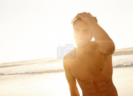 Photo for Man, smile and freedom at the beach on a holiday and summer vacation outdoor with travel. Happy, sea and male person from California by the ocean with confidence and lens flare from trip and journey. - Royalty Free Image