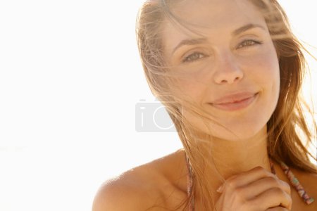 Photo for Woman, portrait and sunshine outdoor with smile, wind and relax on holiday for summer break in nature. Girl, person and happy for adventure, tourism or vacation with face in tropical environment. - Royalty Free Image