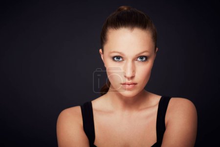 Photo for Portrait, skincare and woman in studio for dermatology, shine or wellness treatment on black background. Cosmetic, beauty or face of female model with glowing skin confidence, cosmetology and serious. - Royalty Free Image