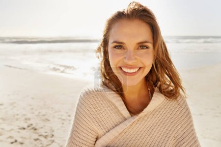 Photo for Travel, portrait and happy woman at a beach for summer, break or vacation, adventure or holiday. Ocean, face and female person smile at the sea with freedom, good mood or solo trip in South Africa. - Royalty Free Image