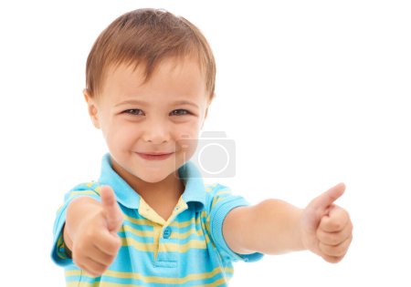 Photo for Boy kid, thumbs up and studio portrait with smile, choice and vote for agreement by white background. Child, model or person in trendy fashion with sign, symbol and icon for yes, thank you or like. - Royalty Free Image