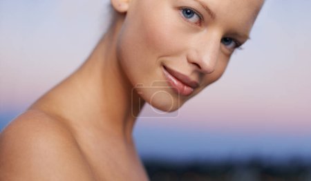 Woman, portrait and skincare outdoor with beauty, spa and facial treatment at sunset with skin glow. Hotel, wellness and female person from Switzerland with cosmetics, resort and relax at dusk.